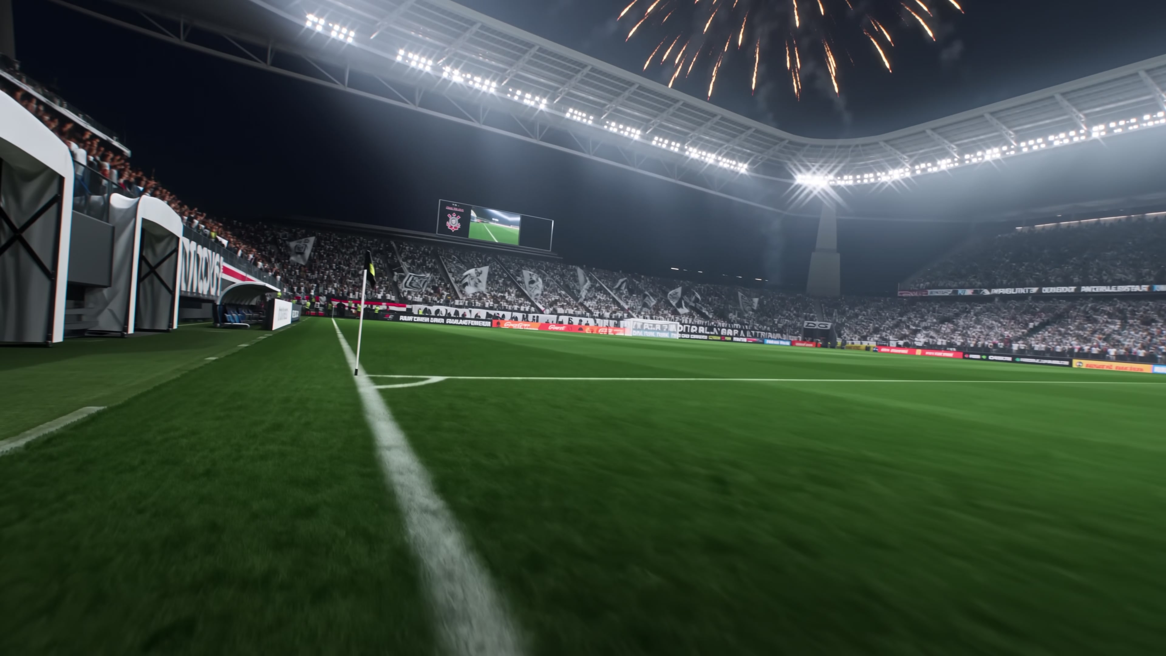 Estádio cheio à noite com fogos sobre a arquibancada